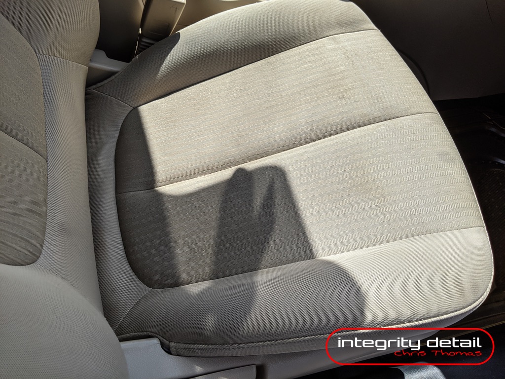 Clean cloth vehicle seat after interior detailing at Integrity Detail