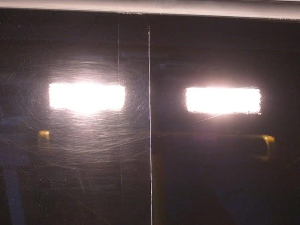 Integrity Detail paint correction example: visible swirl marks on the left and a clearer polished finish on the right under inspection lighting